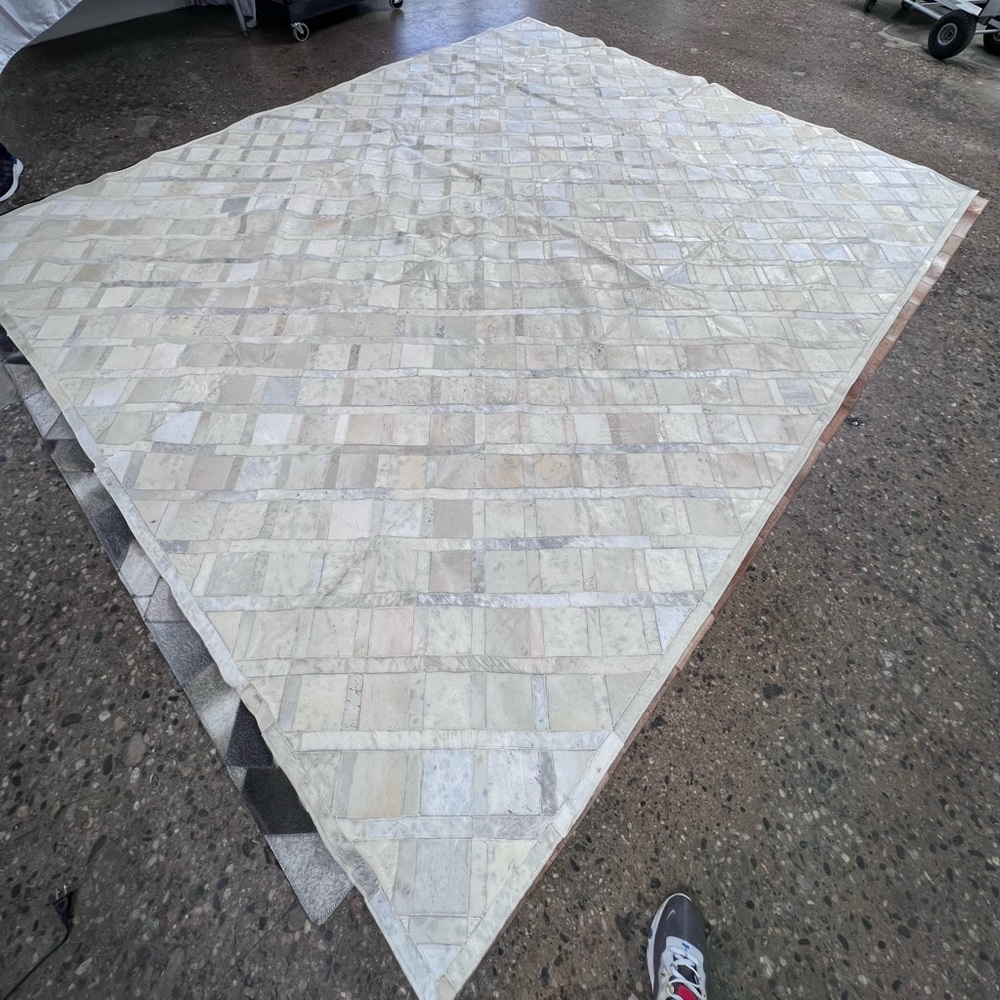 White cowhide patchwork rug